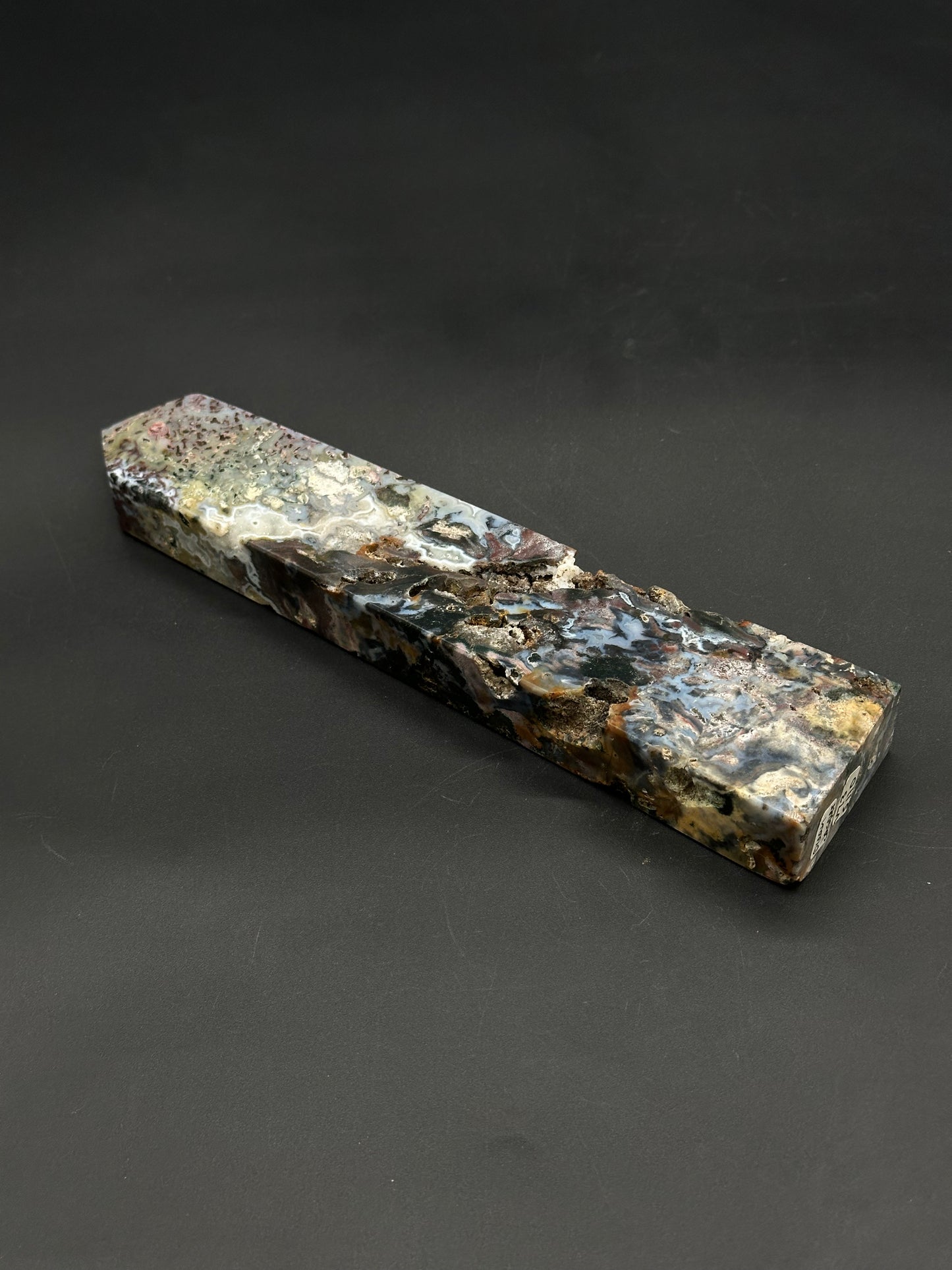 Ocean Jasper Tower (812W08): A polished, rectangular semi-precious stone block with swirling, agate-like patterns and natural cavities, ideal for display or crafting into various items.