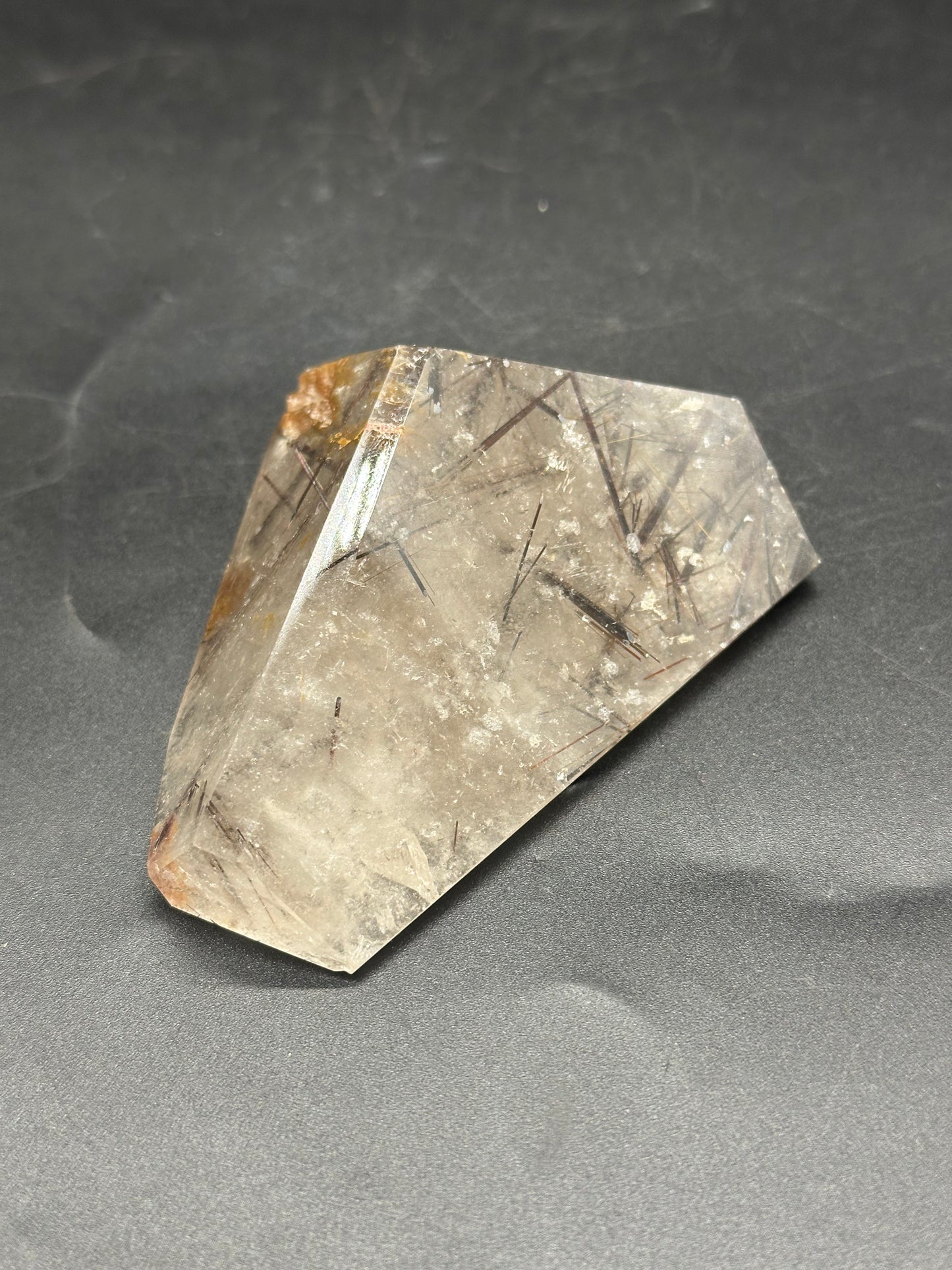 Black Rutilated Quartz (1212W25) showcasing intricate black needle-like inclusions within clear crystal, highlighting its unique mineral structure.