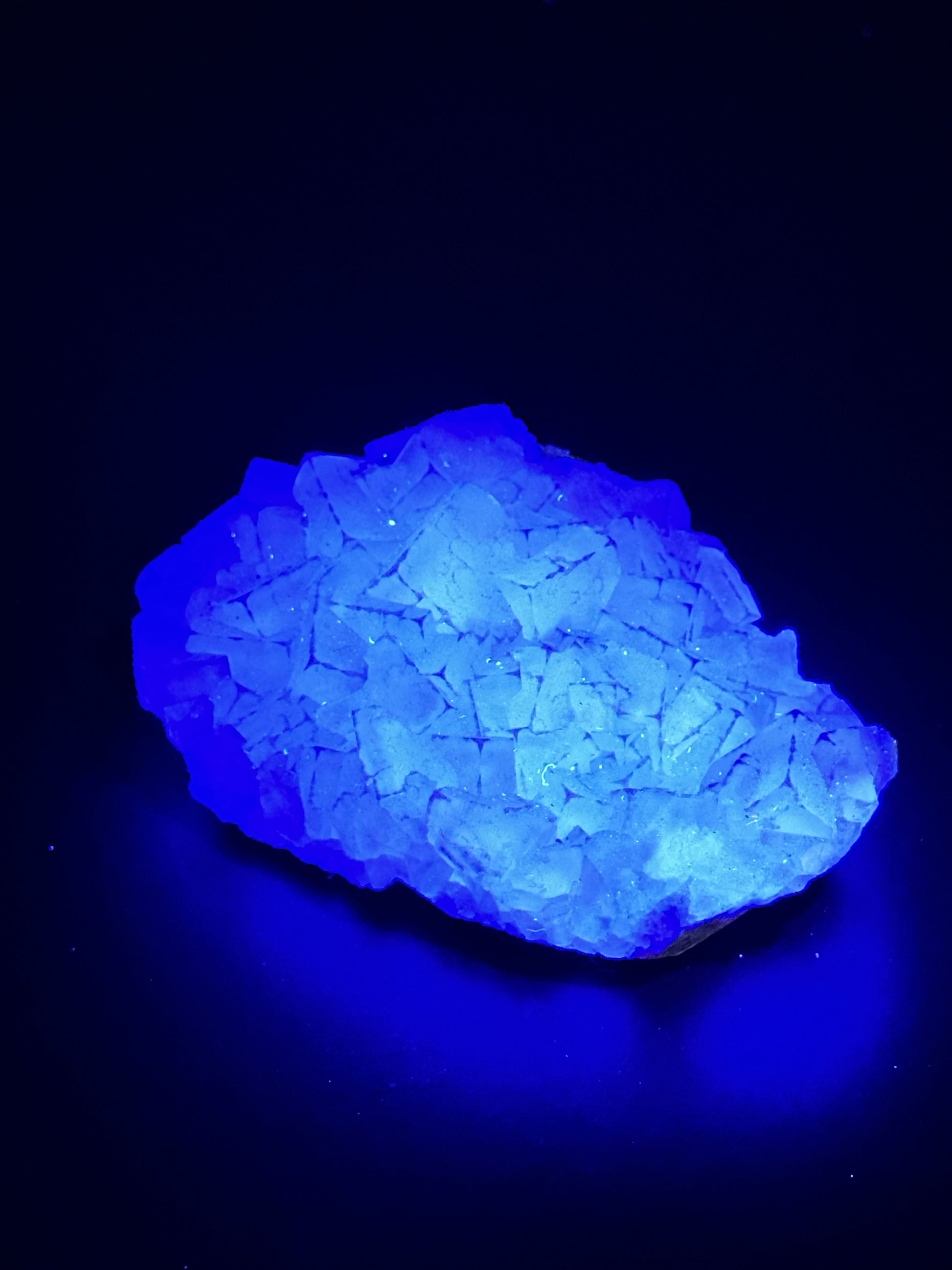 QR Code Fluorite (522W03), a natural mineral, measures 2.7 inches and is UV reactive, showcasing intricate patterns when illuminated.