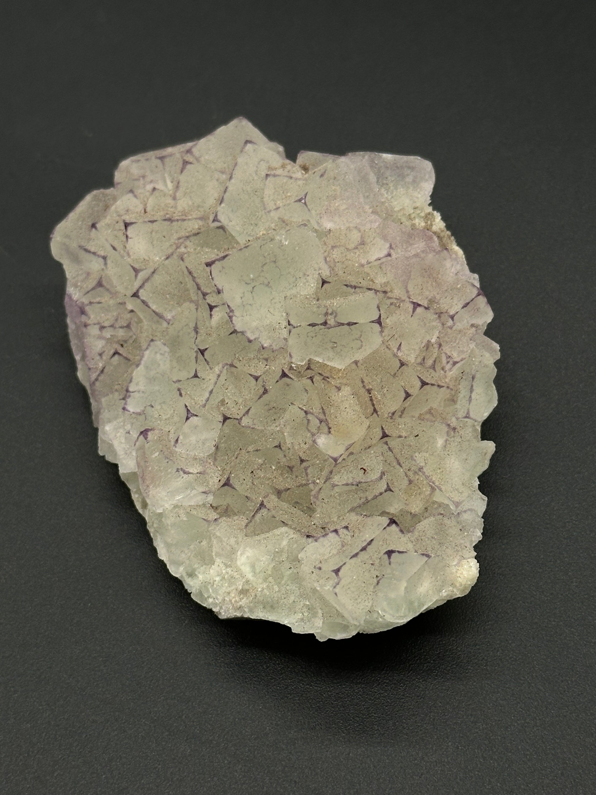 QR Code Fluorite (522W03), a natural mineral, 2.7 inches long, UV reactive, showcasing intricate patterns and textures.