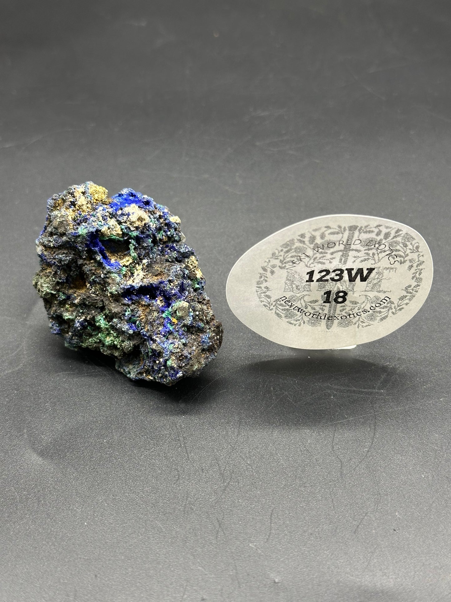 Raw Azurite (123W18) featuring intricate blue and green crystal formations, showcasing its natural gemstone allure. Ideal for collectors and crystal enthusiasts.