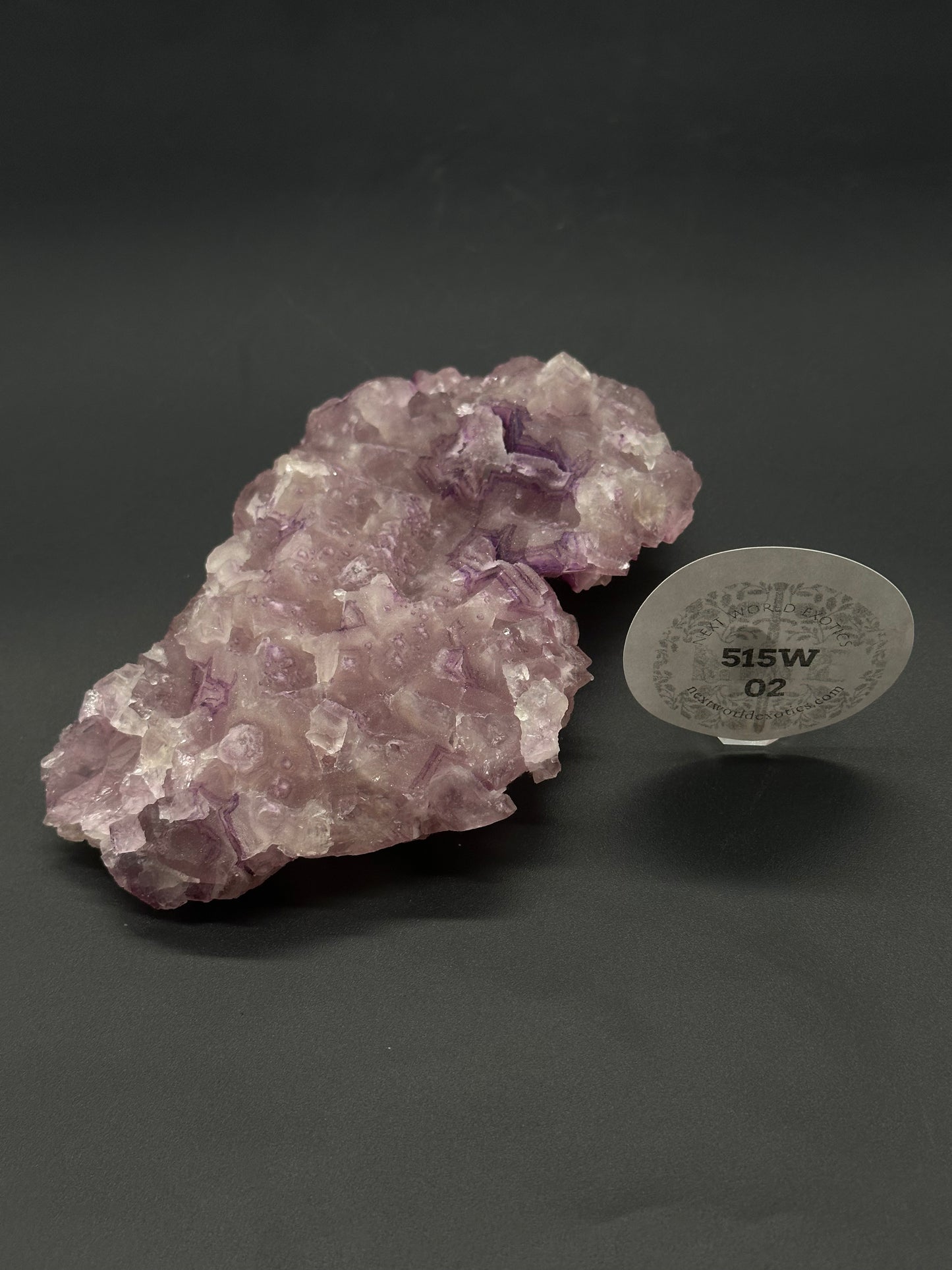 Raw Fluorite (515W02) crystal, showcasing its natural facets and textures, ideal for collectors or as a decorative mineral piece.