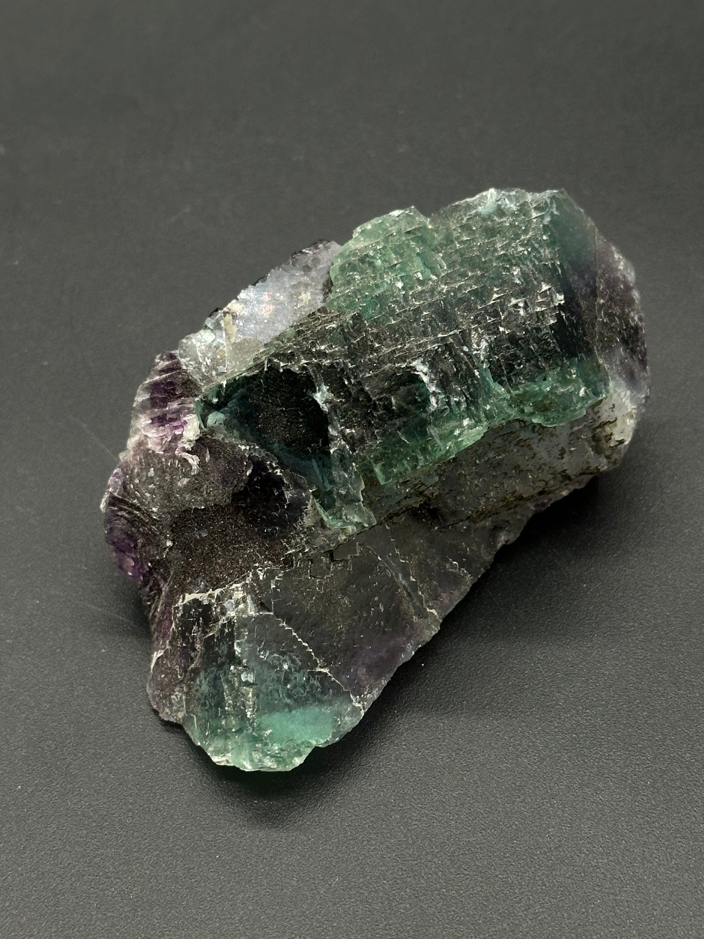 Raw Fluorite (522W02) showcases a natural, unpolished mineral surface, highlighting its unique geometric formations, perfect for crystal collectors or mineral enthusiasts.