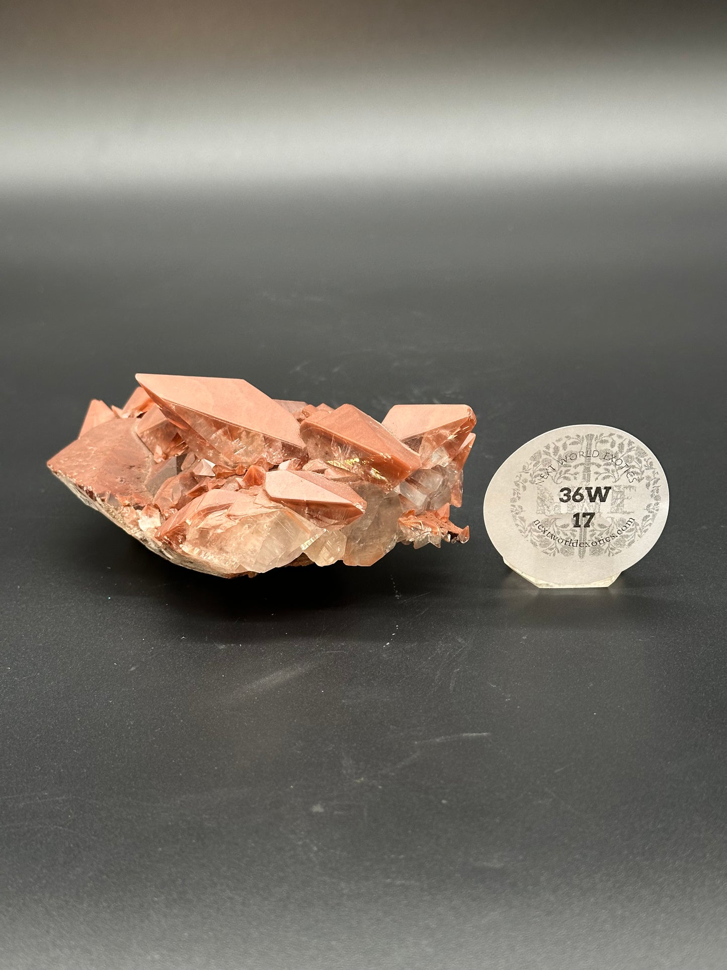 Red Diamond Calcite (36W17) showcasing intricate crystal formations, highlighted in a close-up view, emphasizing its natural mineral structure and detailed surface texture.
