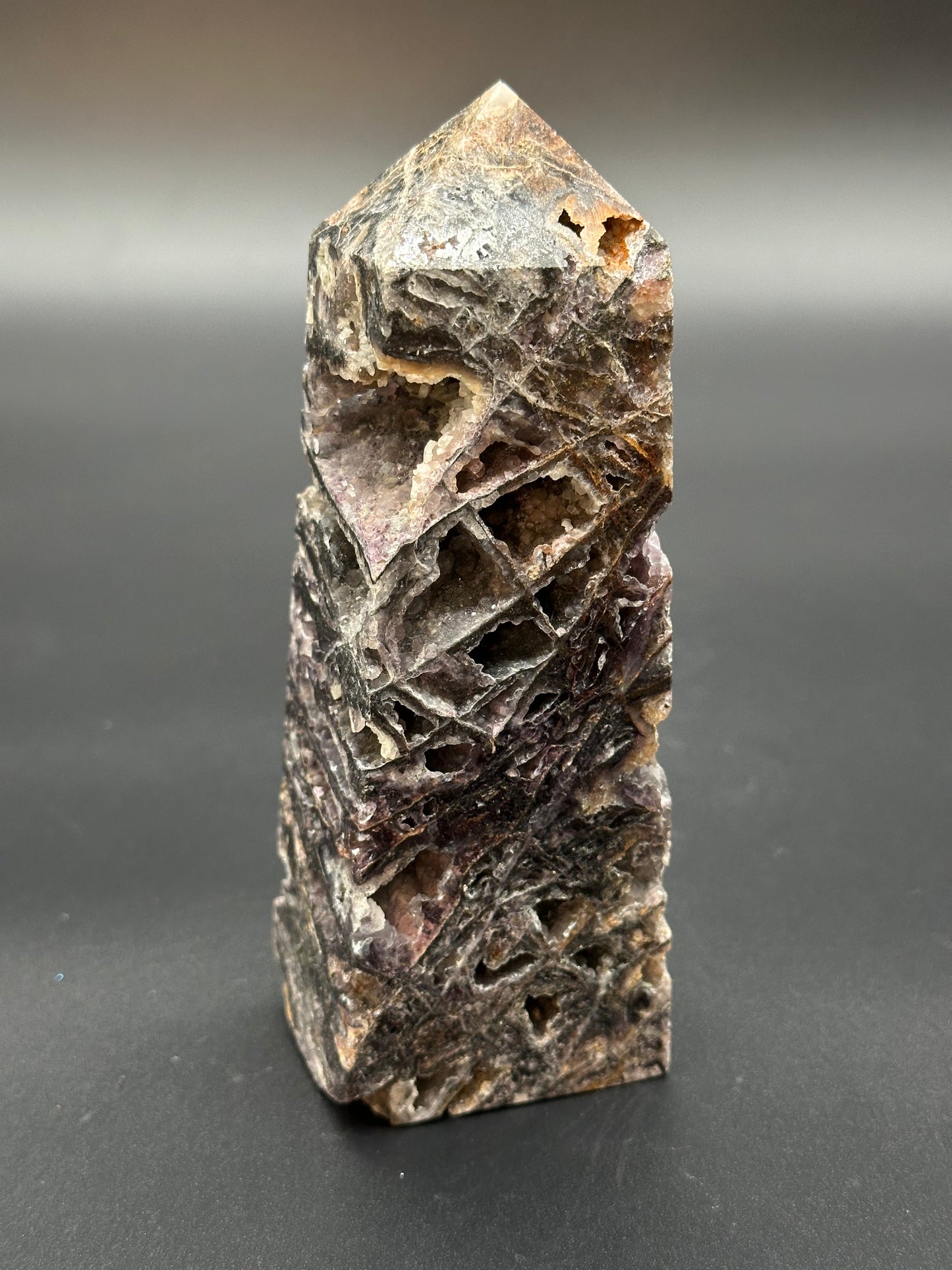 Sphalerite Tower (36W18) showcasing a mineral rock with natural holes and a pointy surface, emphasizing its unique formation and texture.