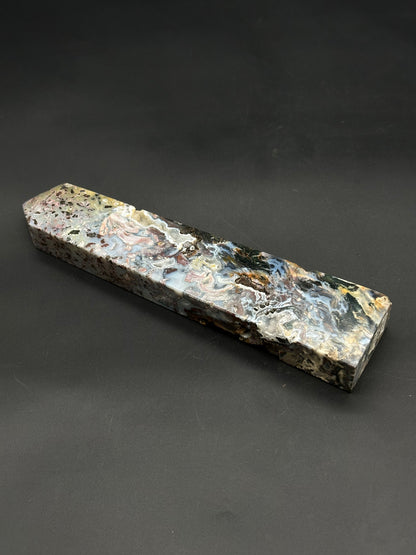Ocean Jasper Tower (812W08) features a marbled, resin-stabilized wood block ideal for crafting knife handles or pen bodies, showcasing fluid swirls and occasional voids.