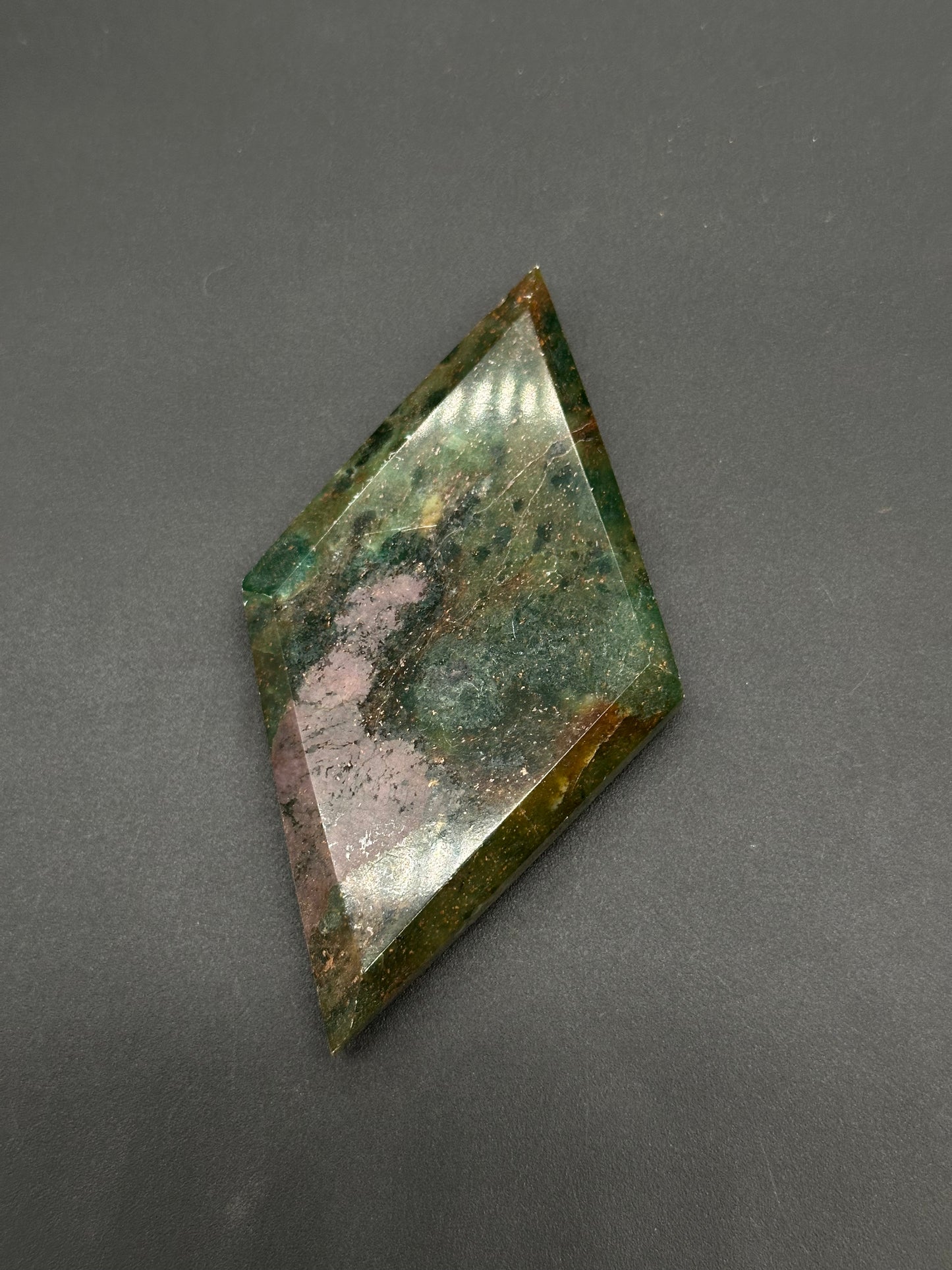 Ruby Kyanite Faceted Diamond (812W13) featuring angular edges and a polished surface, showcasing a blend of smooth, decorative patterns, perfect for collectors.