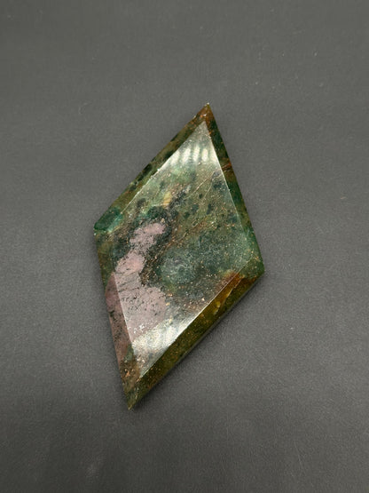 Ruby Kyanite Faceted Diamond (812W13) featuring angular edges and a polished surface, showcasing a blend of smooth, decorative patterns, perfect for collectors.