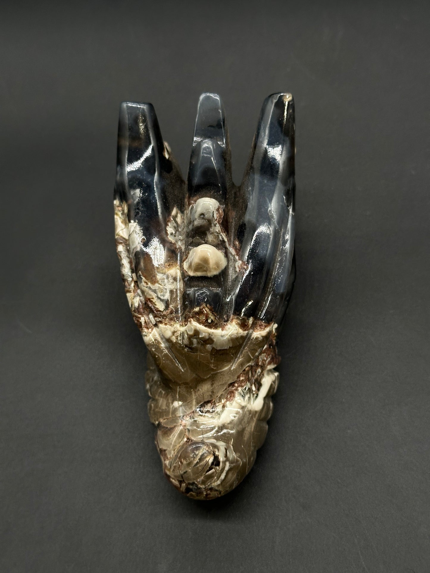 Volcanic Agate Dragon Carving (812W17) features a polished, crown-like structure with three prongs, revealing its cream-and-brown variegated interior.
