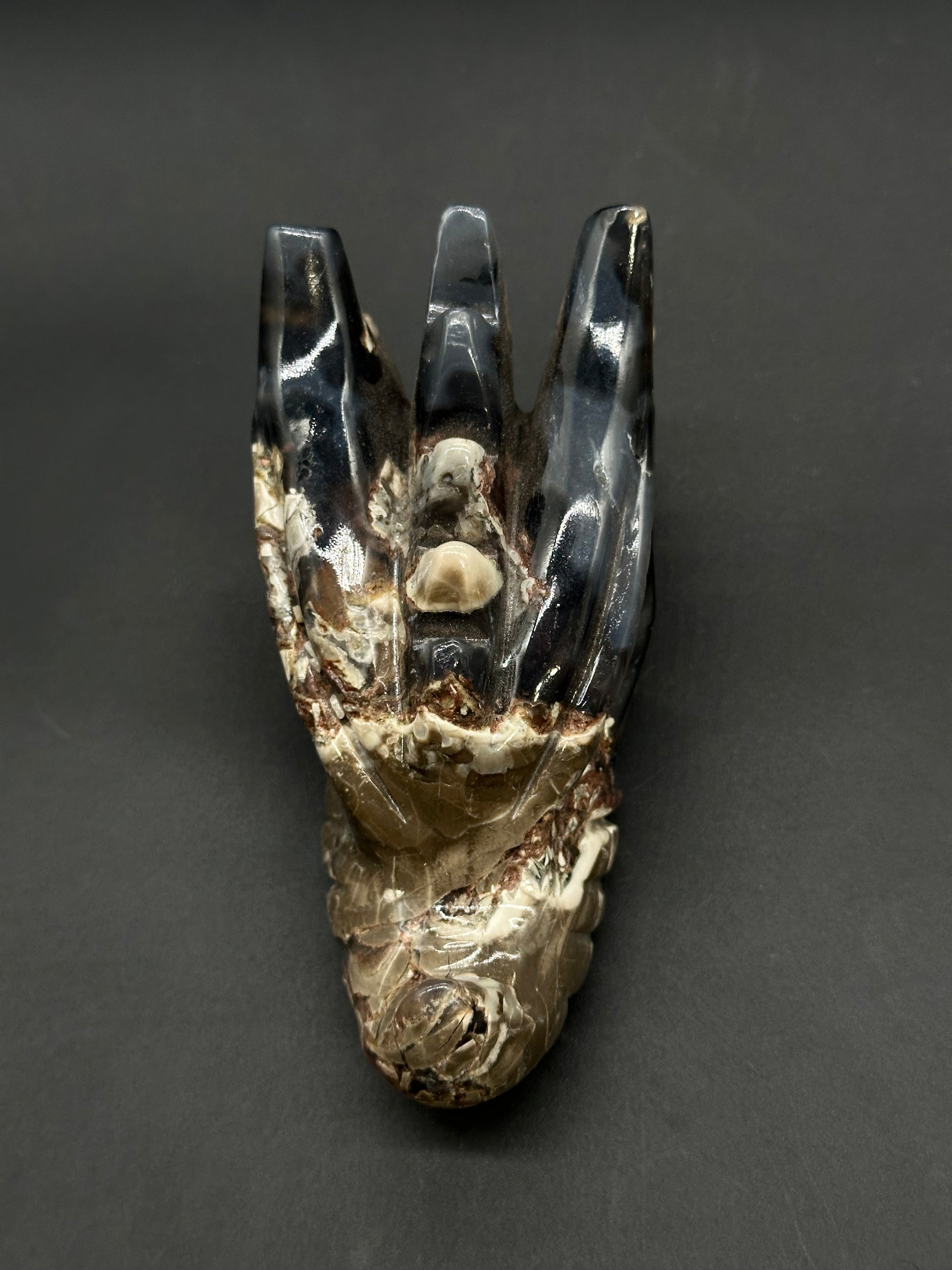 Volcanic Agate Dragon Carving (812W17) features a polished, crown-like structure with three prongs, revealing its cream-and-brown variegated interior.