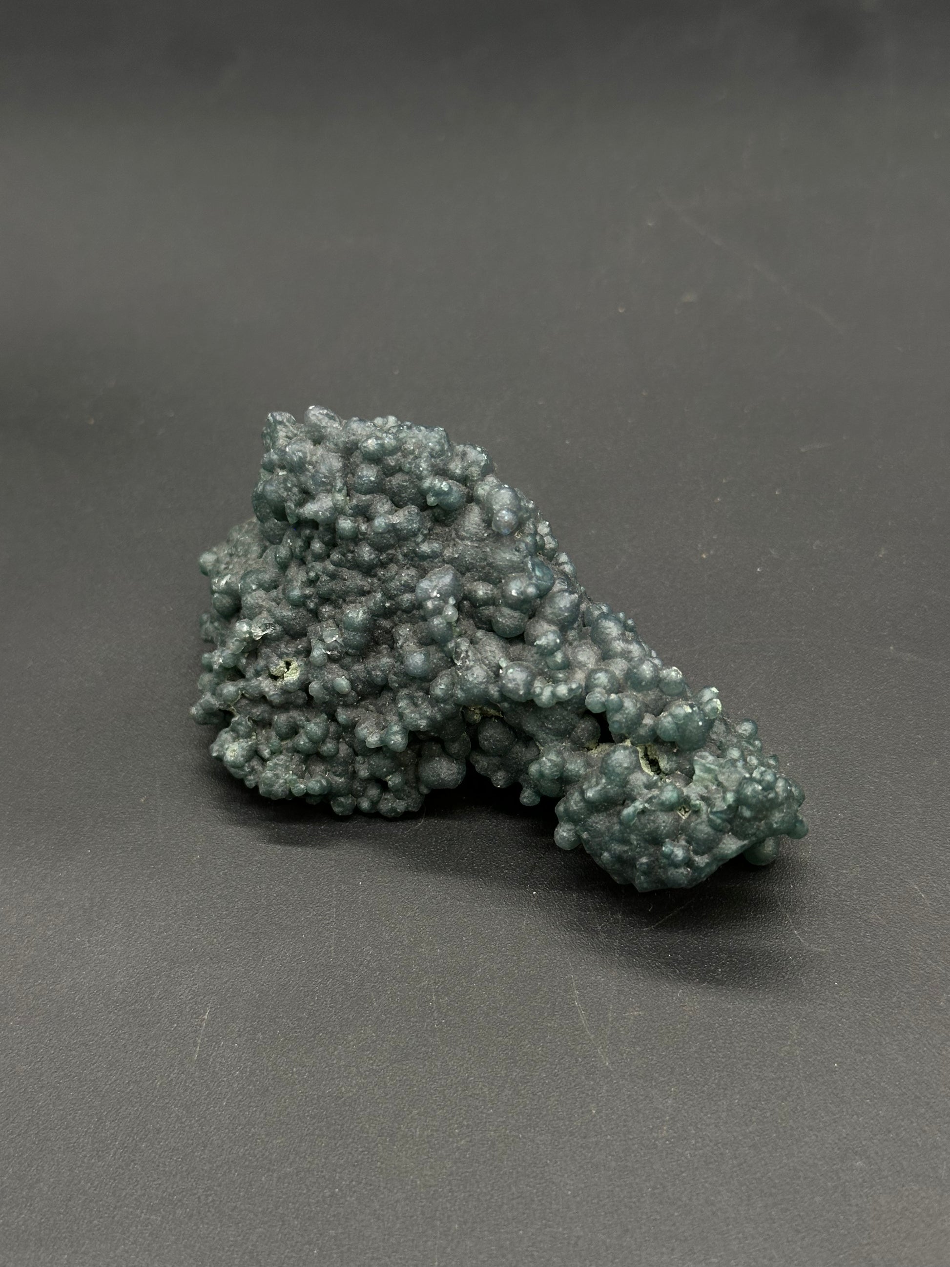 Grape Agate (812W18) features a botryoidal cluster of tiny, rounded nodules, resembling a grape-like mineral formation.