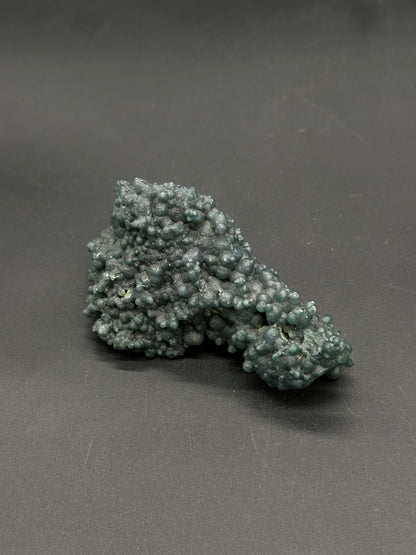 Grape Agate (812W18) features a botryoidal cluster of tiny, rounded nodules, resembling a grape-like mineral formation.