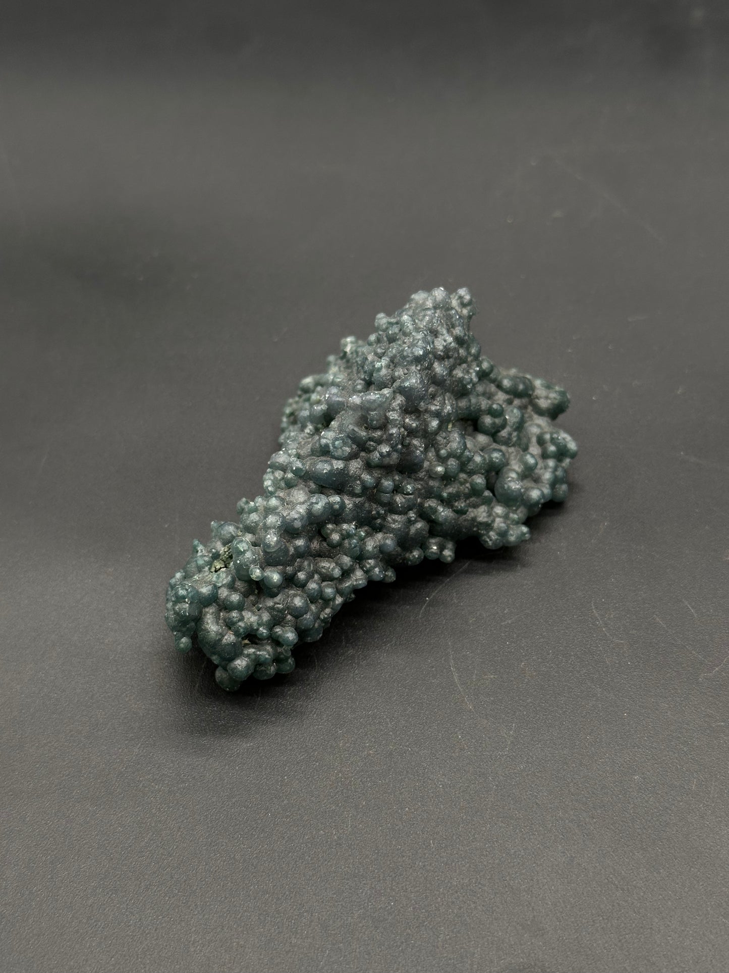 Grape Agate (812W18) mineral specimen with a bumpy, botryoidal surface of rounded nodules, showcasing a slightly metallic sheen.