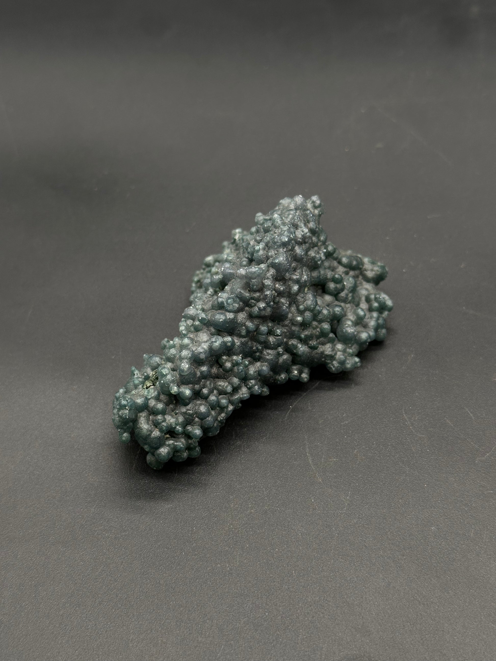 Grape Agate (812W18) mineral specimen with a bumpy, botryoidal surface of rounded nodules, showcasing a slightly metallic sheen.