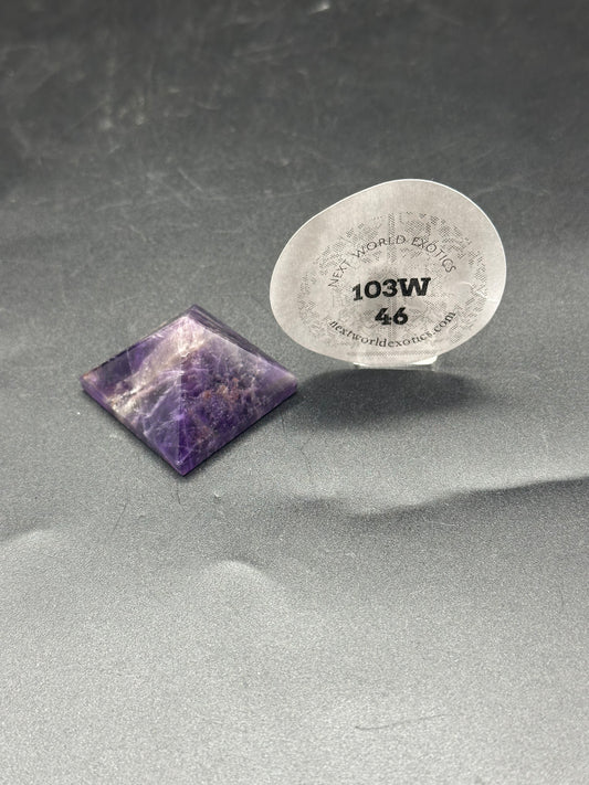 Amethyst Pyramid (103W46) displayed with a round label. Close-up shows intricate stone details.