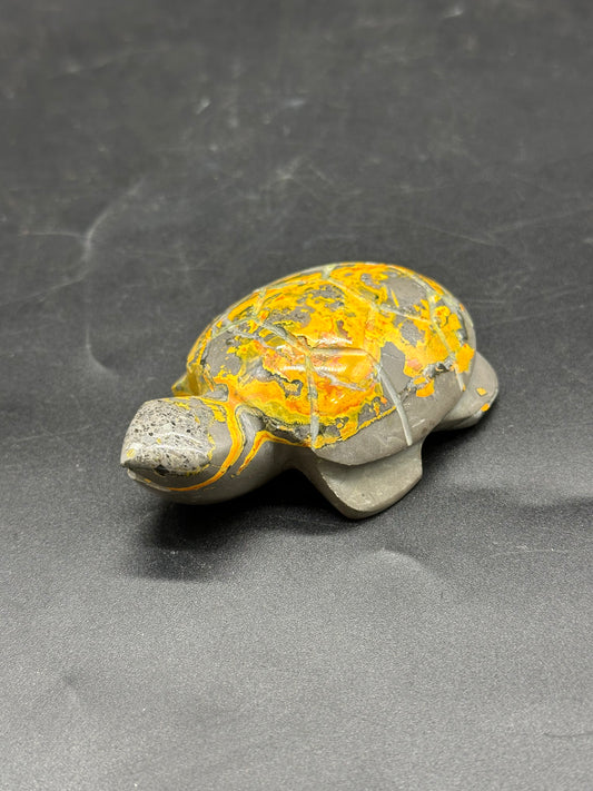 Bumblebee Jasper Turtle Carving (1126W34) features a detailed stone turtle with yellow accents, showcasing intricate craftsmanship and natural charm.