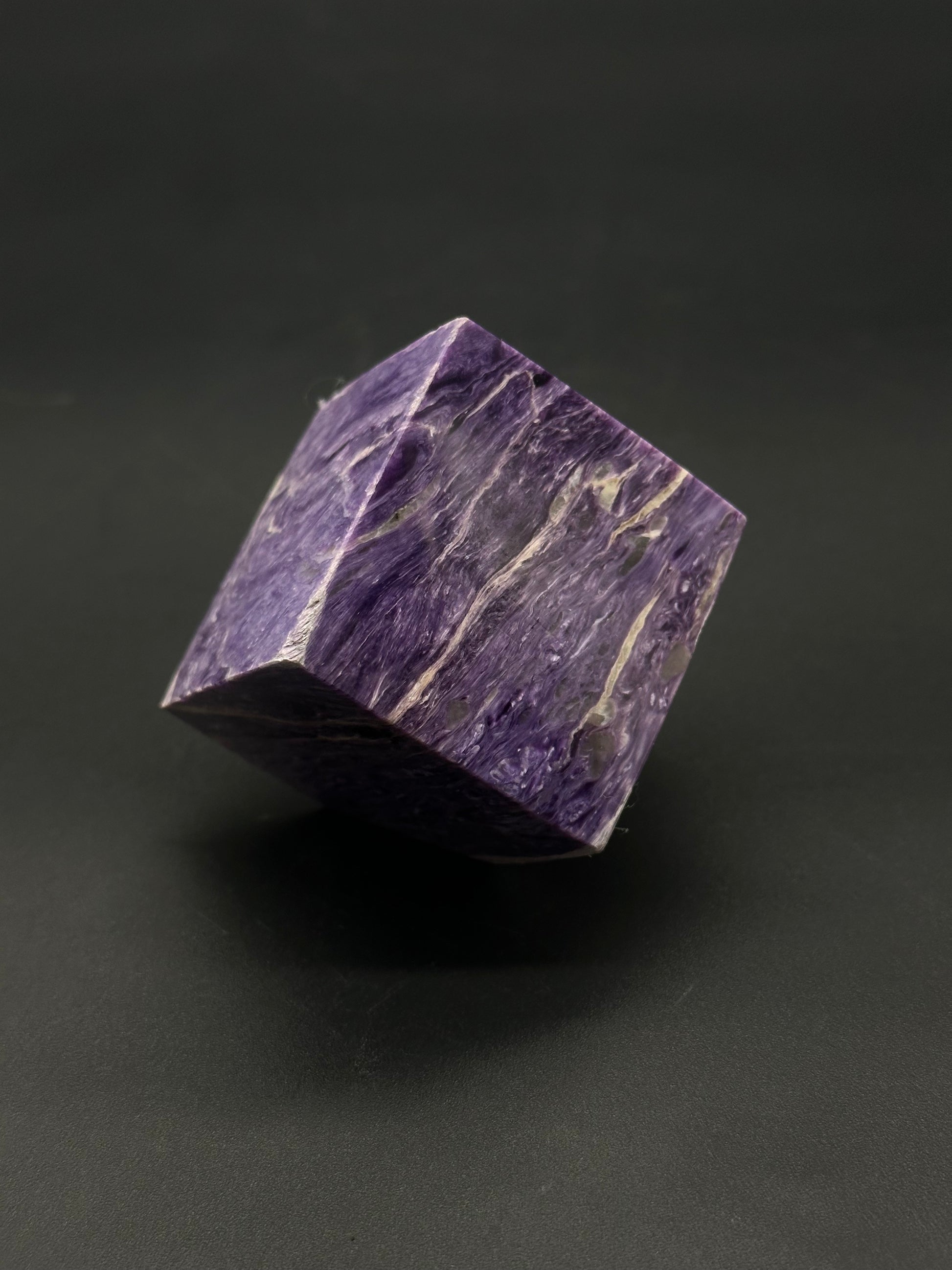 Charoite Cube (515W01) featuring a smooth, polished surface, showcasing unique natural patterns, ideal for mineral enthusiasts and collectors.