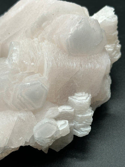 Close-up of Coin Calcite (829W24), a white crystal with intricate formations, ideal for home decor, collections, or spiritual practices.