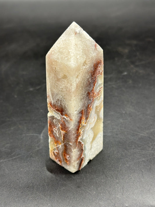 Crazy Lace Agate Tower (1126W37) showcasing intricate patterns and textures, highlighting its natural mineral composition with a polished finish.