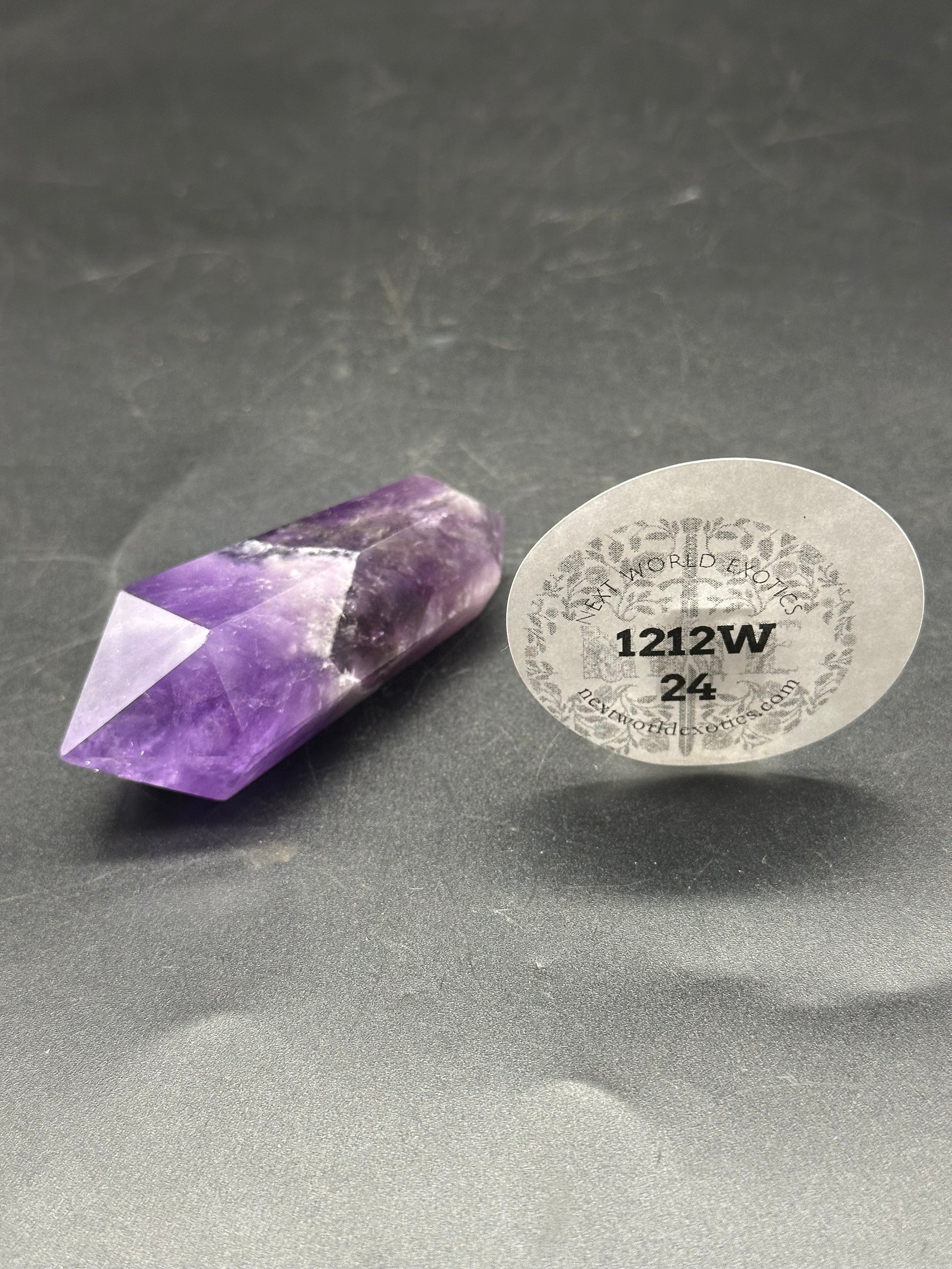 Double Terminated Fluorite (1212W24) with a round white sticker visible, showcasing its unique purple and white crystalline structure.