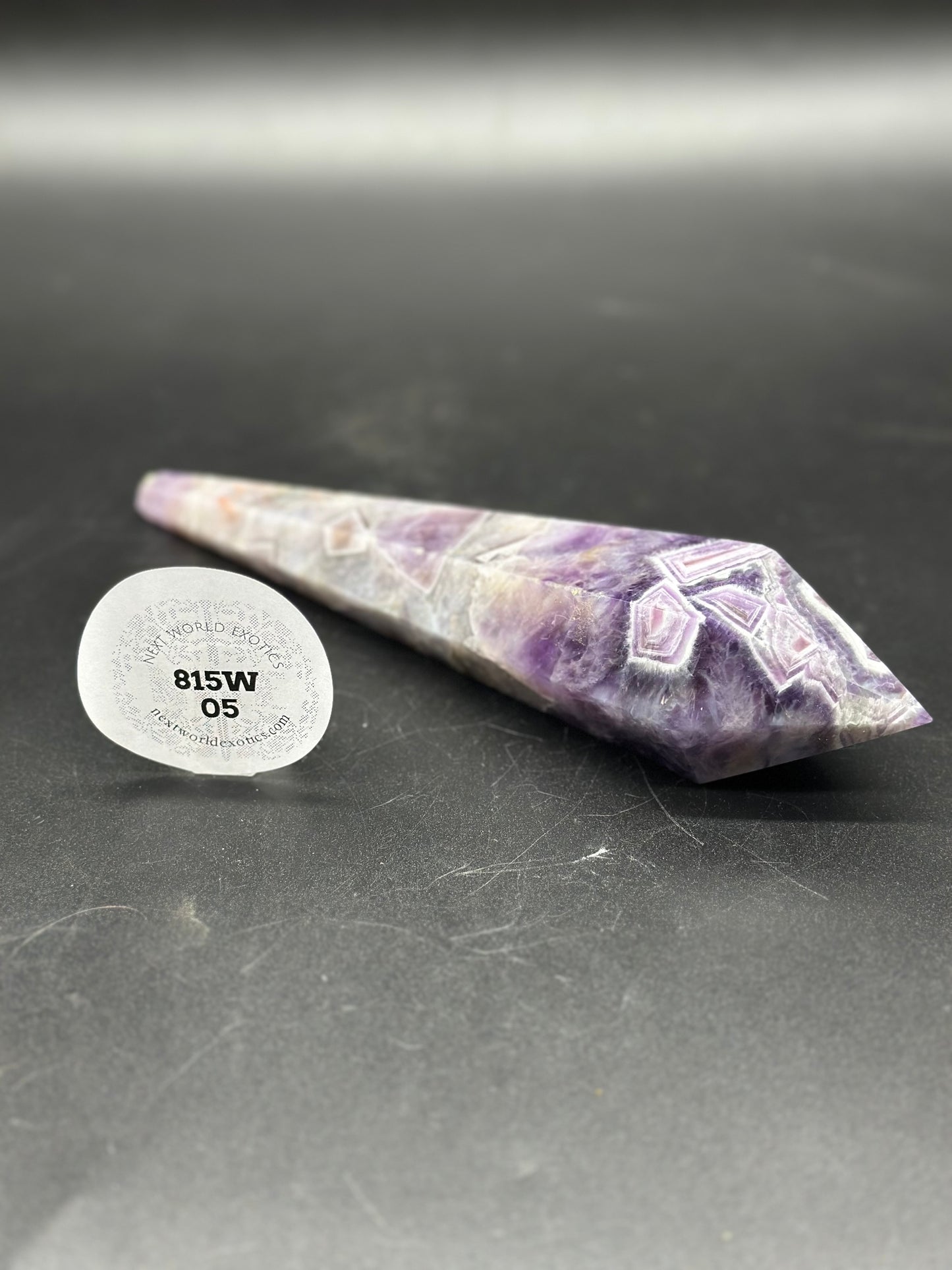 Dream Amethyst Scepter (815W05) featuring a pointy purple and white crystal, accompanied by a white sticker with black text and numbers.