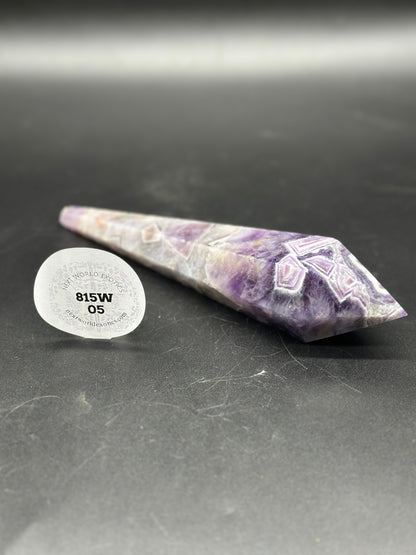 Dream Amethyst Scepter (815W05) featuring a pointy purple and white crystal, accompanied by a white sticker with black text and numbers.