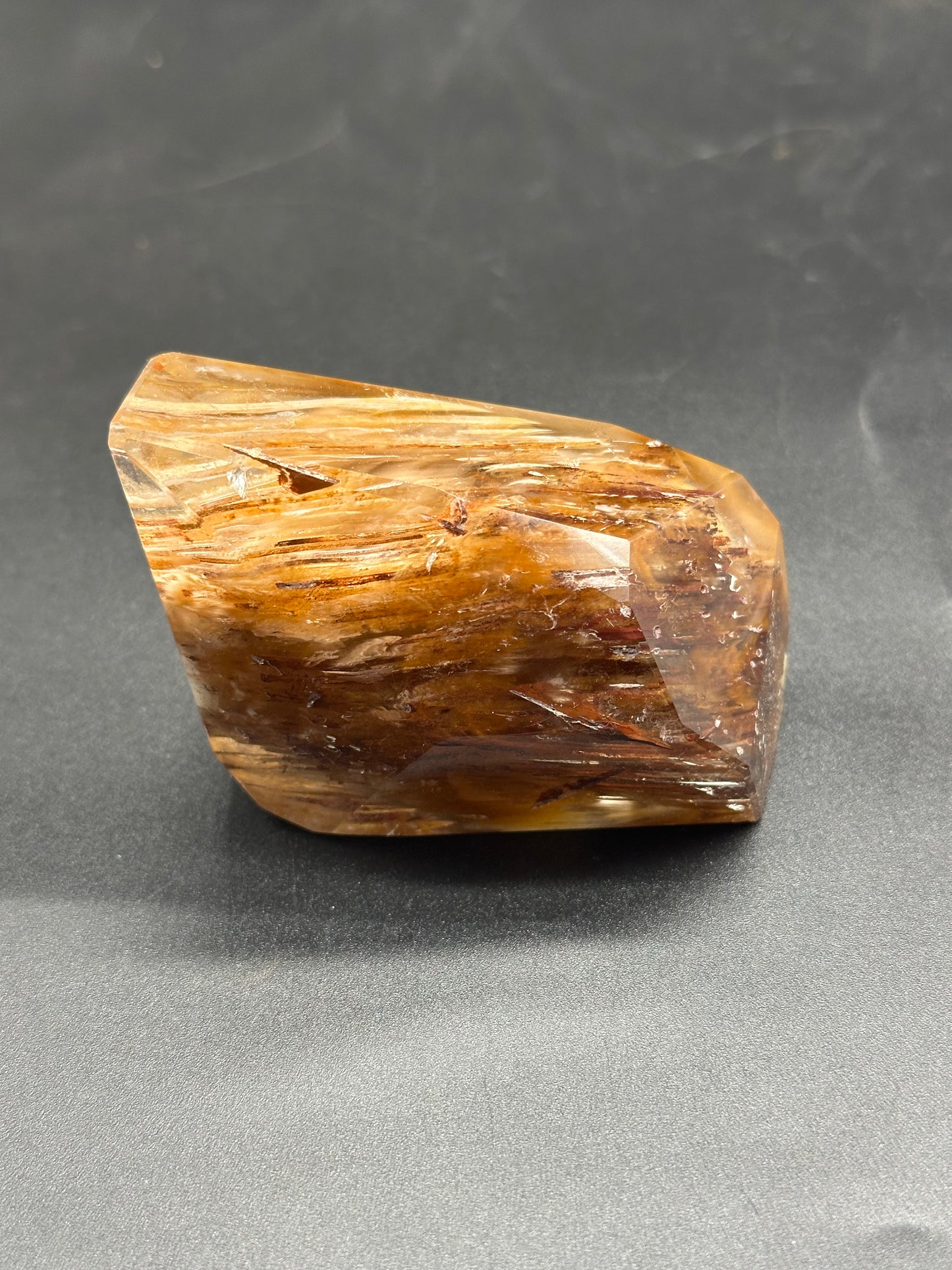 Close-up of Rabbit's Hair Rutilated Quartz (1024W47), showcasing intricate crystal structures and fine rutile inclusions, emphasizing its unique mineral characteristics.