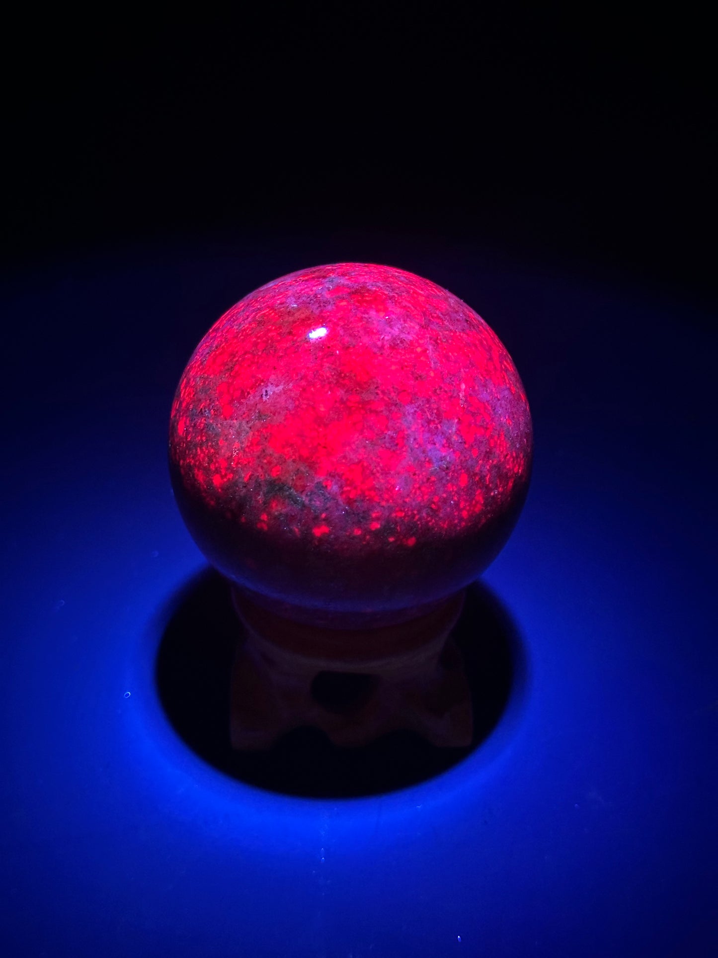 Ruby Kyanite Sphere 2.1-inch diameter, polished, close-up view highlighting its smooth, round surface.