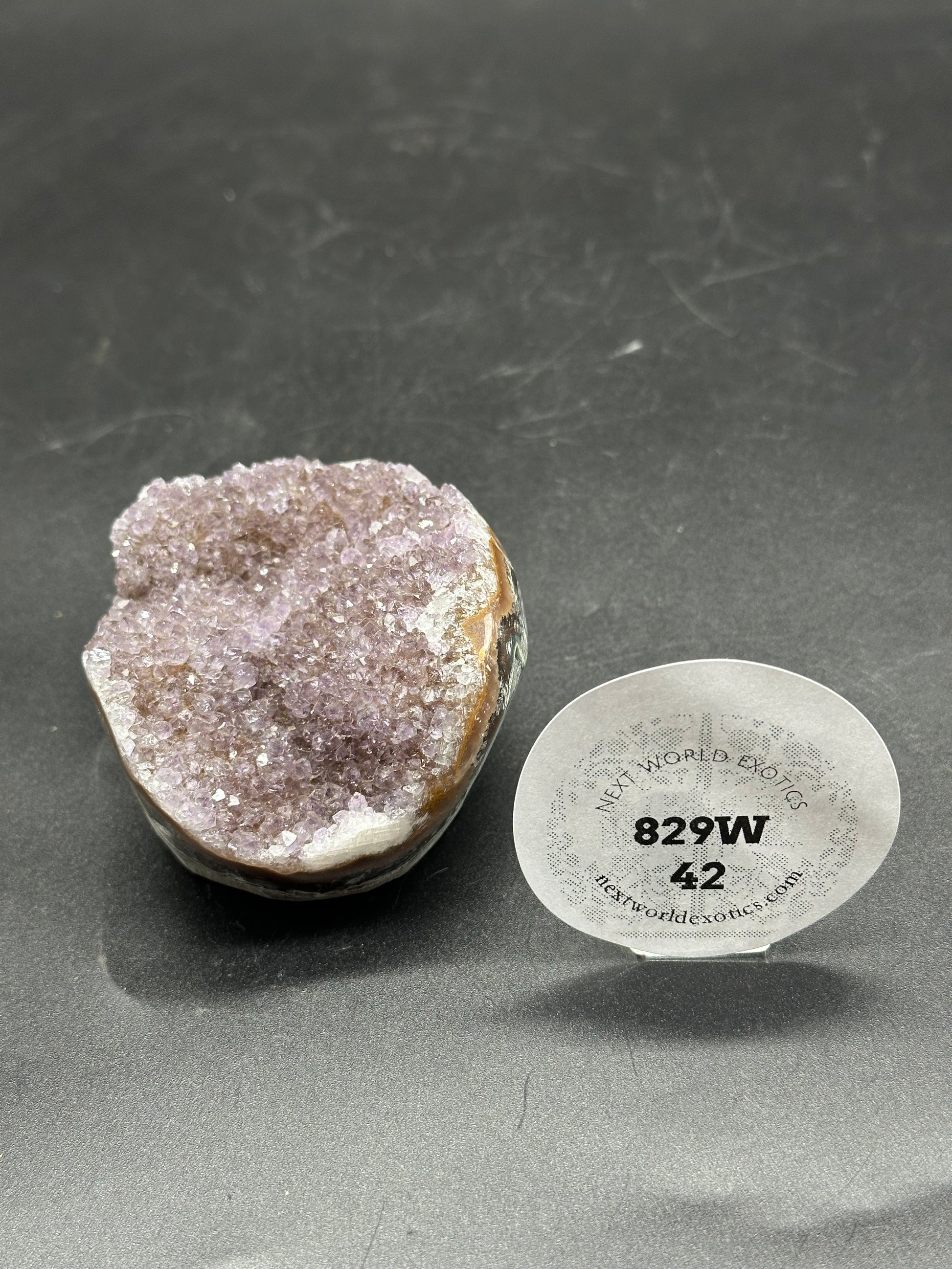 Sugar Fluorite Bowl (829W42) featuring a round white sticker with a close-up of a purple rock.