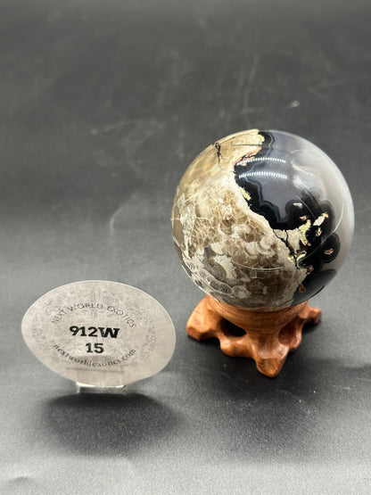 Volcanic Agate Sphere (912W15) displayed on a stand, showcasing its unique cracked surface texture and circular form, ideal for decor or collection.