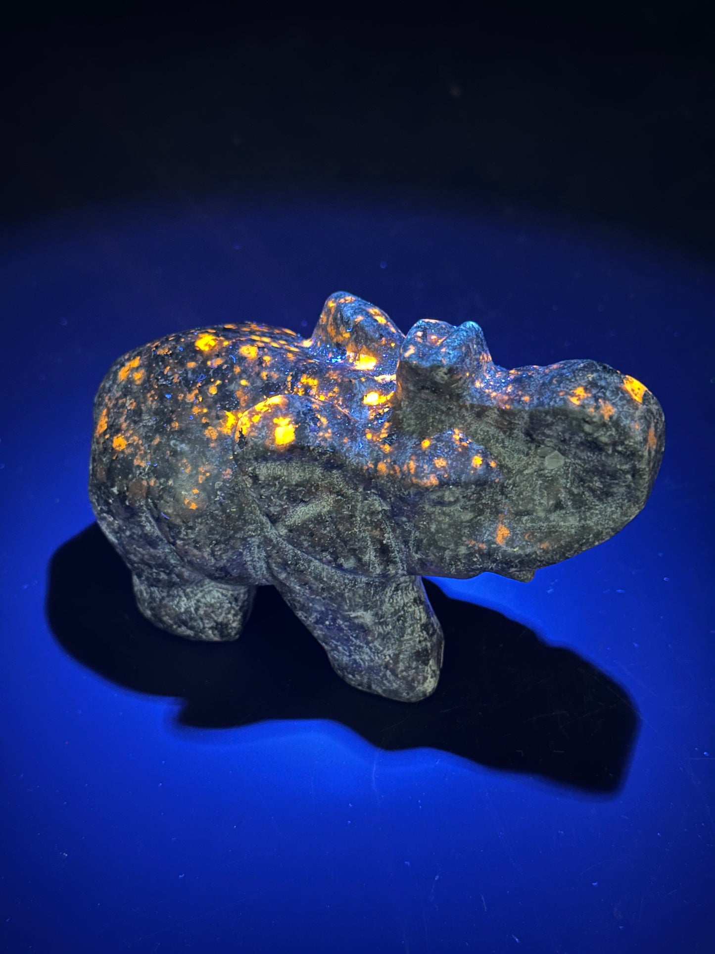 Yooperlite Elephant Carving (103W52), a detailed stone elephant with distinctive mineral patterns, showcasing expert craftsmanship.